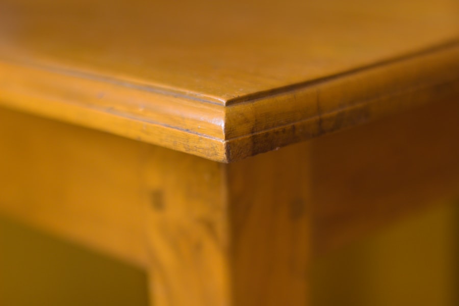 The chamfered edge of a solid oak table in warm light.